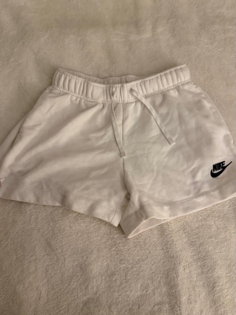 Nike Women's White Athletic Shorts with Black Swoosh